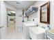 Bright laundry room featuring a washer, dryer, and storage; seamlessly blends utility with style at 5300 S Atlantic Ave # 3-504, New Smyrna Beach, FL 32169