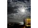 Night view featuring a building near a beach under a cloudy sky with a bright moon and stars at 5300 S Atlantic Ave # 3-504, New Smyrna Beach, FL 32169