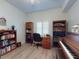 Office room featuring wood desk, bookshelf, and hardwood floors at 5300 S Atlantic Ave # 3-504, New Smyrna Beach, FL 32169