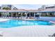 Large pool with ample lounge seating with covered veranda to escape the sun at 5300 S Atlantic Ave # 3-504, New Smyrna Beach, FL 32169