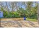 Landscaped backyard with brick patio and shed at 610 Renner Rd, Port Orange, FL 32127