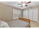 Bedroom with double closets and tile floors at 610 Renner Rd, Port Orange, FL 32127