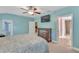 Serene bedroom with a king-size bed and access to the bathroom at 610 Renner Rd, Port Orange, FL 32127