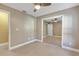 Bedroom with mirrored closet doors and tile floors at 610 Renner Rd, Port Orange, FL 32127