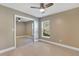 Bedroom with mirrored closet doors and tile floors at 610 Renner Rd, Port Orange, FL 32127