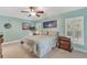 Spacious bedroom with light blue walls, king-size bed, and ample natural light at 610 Renner Rd, Port Orange, FL 32127