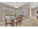 Casual dining area with glass table and wooden chairs, near pool access at 610 Renner Rd, Port Orange, FL 32127