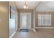 Bright entryway with tile floors and frosted glass door at 610 Renner Rd, Port Orange, FL 32127