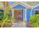 Front entrance with red door and stone accents at 610 Renner Rd, Port Orange, FL 32127