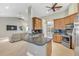 Open kitchen with island, stainless steel appliances, and granite countertops at 610 Renner Rd, Port Orange, FL 32127