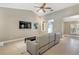 Comfortable living room with sectional sofa and ceiling fan at 610 Renner Rd, Port Orange, FL 32127