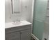 Bathroom featuring gray vanity and a stand-up glass door shower at 621 Middlebury Loop, New Smyrna Beach, FL 32168