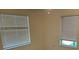 Cozy bedroom with two large windows providing ample natural light at 621 Middlebury Loop, New Smyrna Beach, FL 32168