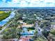 Aerial view capturing the home's prime location, set amongst lush surroundings and vibrant coastal scenery at 634 N Riverside Dr, New Smyrna Beach, FL 32168