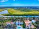 Expansive aerial shot showcasing this home's waterfront location with stunning natural surroundings and city views at 634 N Riverside Dr, New Smyrna Beach, FL 32168