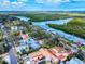 Scenic waterway aerial view showcasing docks, landscaping, and homes at 634 N Riverside Dr, New Smyrna Beach, FL 32168