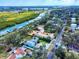 Panoramic aerial of the neighborhood highlighting waterways, lush landscapes, and close proximity to the city at 634 N Riverside Dr, New Smyrna Beach, FL 32168