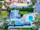 Aerial view of home showcasing the pool, lush landscaping, and distinctive architecture at 634 N Riverside Dr, New Smyrna Beach, FL 32168