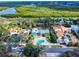 Wide aerial captures the home's unique setting, backing onto picturesque waterway and mature greenery at 634 N Riverside Dr, New Smyrna Beach, FL 32168