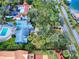 Overhead image of the home, pool, landscaping, and proximity to the street at 634 N Riverside Dr, New Smyrna Beach, FL 32168