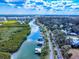 Scenic aerial view of a waterway featuring waterfront homes and lush foliage at 634 N Riverside Dr, New Smyrna Beach, FL 32168