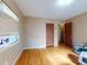 Bedroom featuring hardwood floors, multiple closets, and natural light from a window at 634 N Riverside Dr, New Smyrna Beach, FL 32168