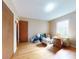 Bedroom featuring hardwood floors, a closet, and ample natural light from a window at 634 N Riverside Dr, New Smyrna Beach, FL 32168