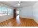 Bedroom featuring hardwood floors and large windows providing natural light at 634 N Riverside Dr, New Smyrna Beach, FL 32168