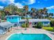 Charming home with vibrant colors and a private pool, perfect for relaxation and outdoor enjoyment at 634 N Riverside Dr, New Smyrna Beach, FL 32168