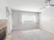 Living room with stone fireplace, ceiling fan, neutral carpet and natural light at 634 N Riverside Dr, New Smyrna Beach, FL 32168