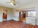 Bright living room featuring tile flooring, ceiling fan, and connected spaces at 634 N Riverside Dr, New Smyrna Beach, FL 32168