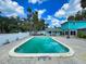 Large in-ground swimming pool with a spacious deck and lush landscaping providing a private outdoor retreat at 634 N Riverside Dr, New Smyrna Beach, FL 32168