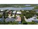 Aerial showing home with solar panels near water at 6345 River Rd, New Smyrna Beach, FL 32169