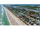 Aerial view showing home's location near beach and lagoon access at 6345 River Rd, New Smyrna Beach, FL 32169