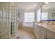 Elegant bathroom with soaking tub, double vanity and glass shower at 6345 River Rd, New Smyrna Beach, FL 32169