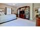 Spacious bedroom with king-size bed and an entertainment center at 6345 River Rd, New Smyrna Beach, FL 32169