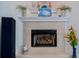 Corner fireplace with white mantel and beige tile surround at 6345 River Rd, New Smyrna Beach, FL 32169