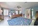 Main bedroom with king bed and access to private balcony at 6345 River Rd, New Smyrna Beach, FL 32169