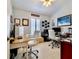 Home office with two desks, white chairs, and beach-themed decor at 6345 River Rd, New Smyrna Beach, FL 32169