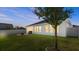 Spacious backyard with a large grassy area and privacy fence at 6807 Ragatz Ln, Port Orange, FL 32128