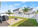 Backyard with patio, grill, and grassy area at 6807 Ragatz Ln, Port Orange, FL 32128