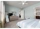 Bright bedroom with dresser, TV, and ensuite bathroom at 6807 Ragatz Ln, Port Orange, FL 32128