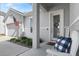 Front porch with white rocking chairs and welcome sign at 6807 Ragatz Ln, Port Orange, FL 32128