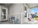 Front porch with white rocking chairs and welcome sign at 6807 Ragatz Ln, Port Orange, FL 32128