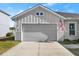 Two car garage with American flag at 6807 Ragatz Ln, Port Orange, FL 32128