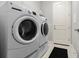 Convenient laundry room with washer and dryer and extra storage at 6807 Ragatz Ln, Port Orange, FL 32128