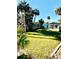 Large grassy backyard, offering ample space for outdoor activities at 69 E Bayshore Dr, Port Orange, FL 32127