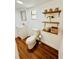 Updated half bathroom with floating shelves at 69 E Bayshore Dr, Port Orange, FL 32127