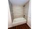 Bathroom with a new tub and tile surround at 69 E Bayshore Dr, Port Orange, FL 32127