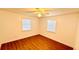 Bright bedroom with wood-look floors and two windows at 69 E Bayshore Dr, Port Orange, FL 32127